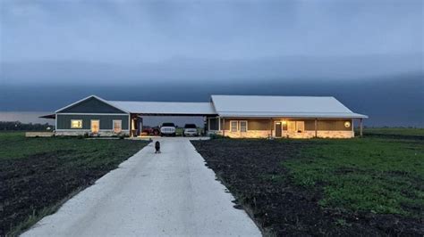 metal barn next to house connected by breezeway|barndo with breezeway.